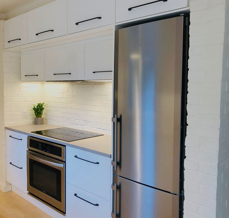 Refrigerator and stove in remodeled IKEA kitchen