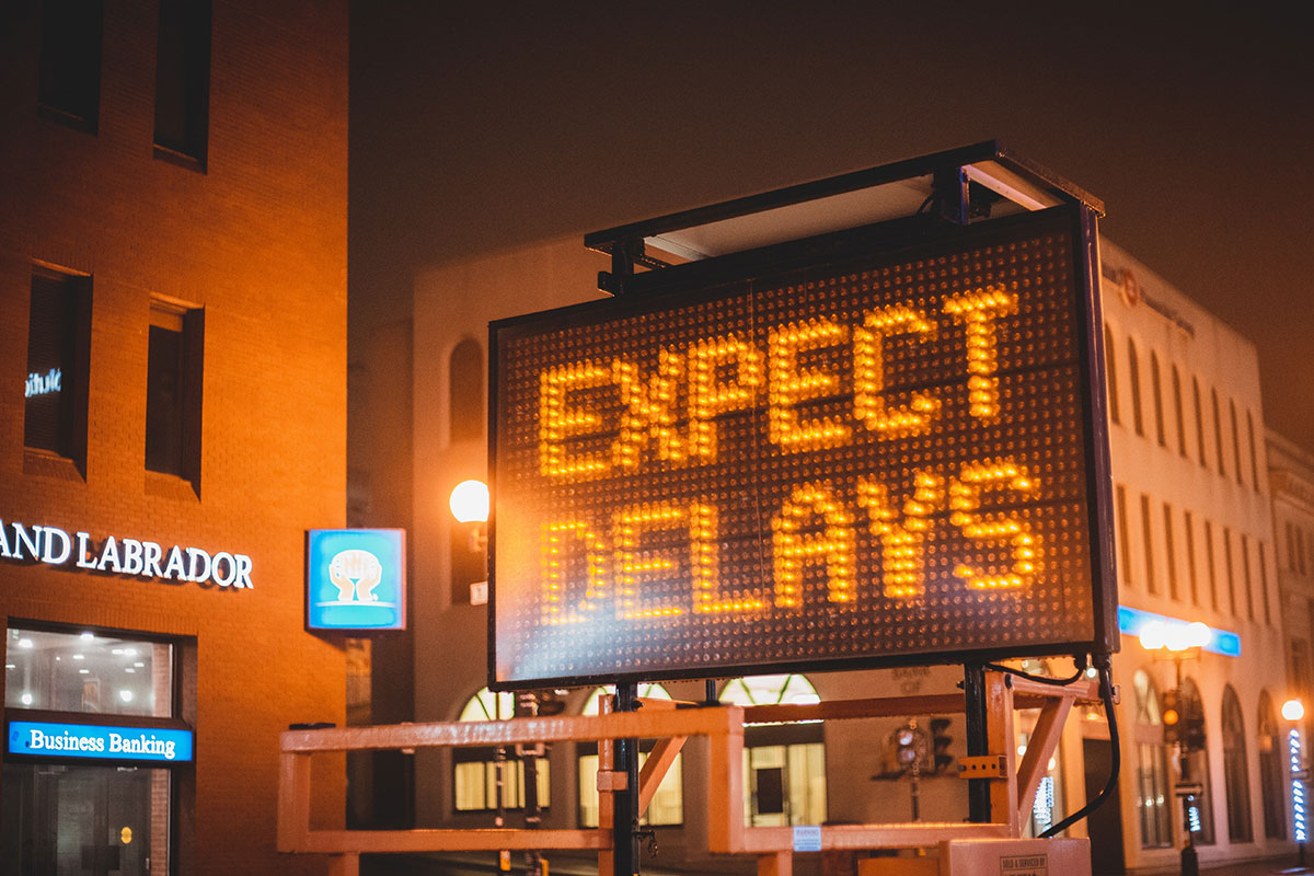 expect delays road sign
