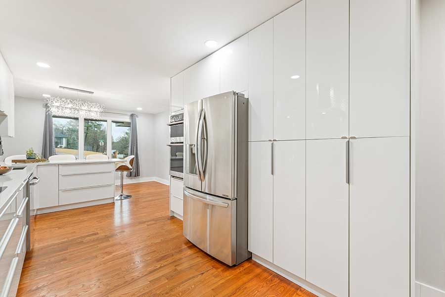stainless steel fridge in white kitchen