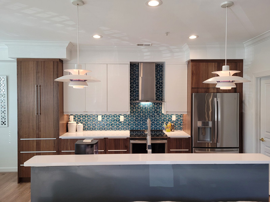 large kitchen island with sink and unique lighting