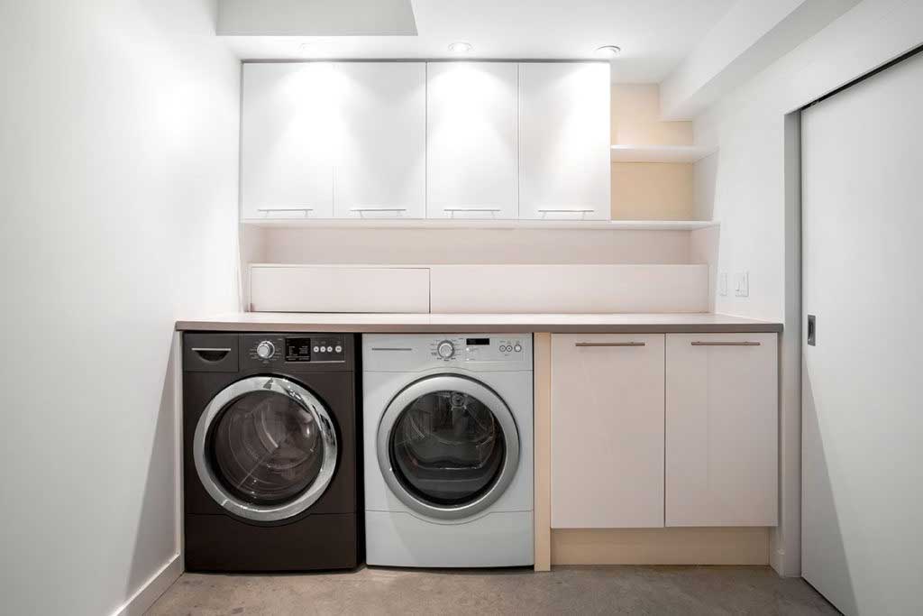 Simple laundry room design with front-load washer and dryer