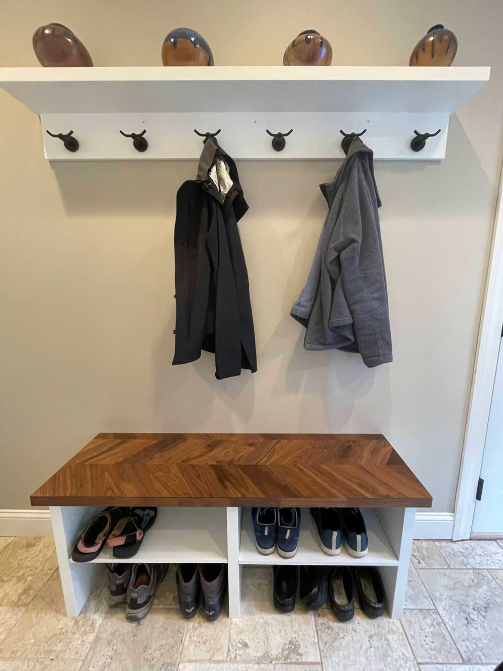 Coat rack in mudroom all white