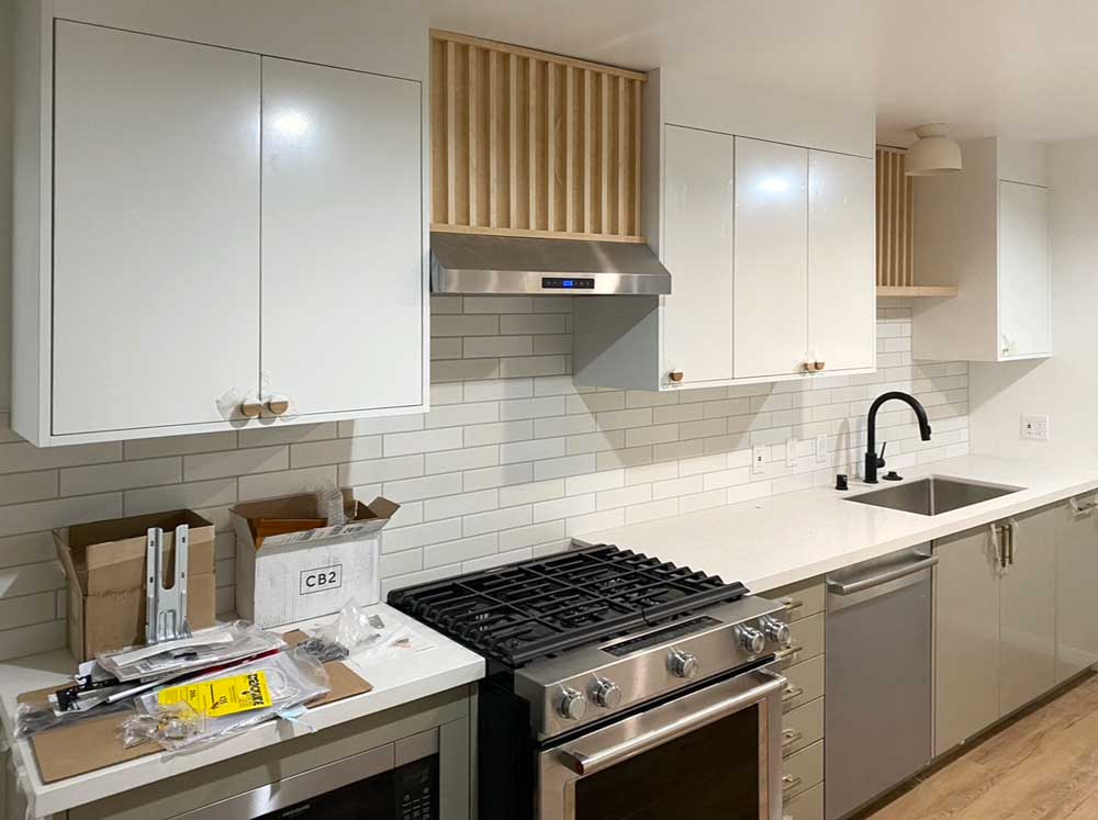 White kitchen with stainless steel appliances