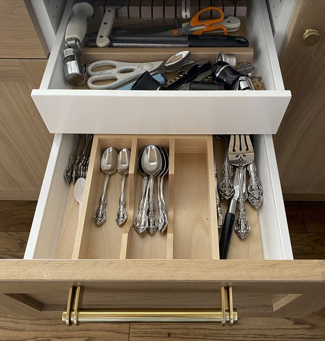 custom hidden drawer for silverware and other miscellaneous items