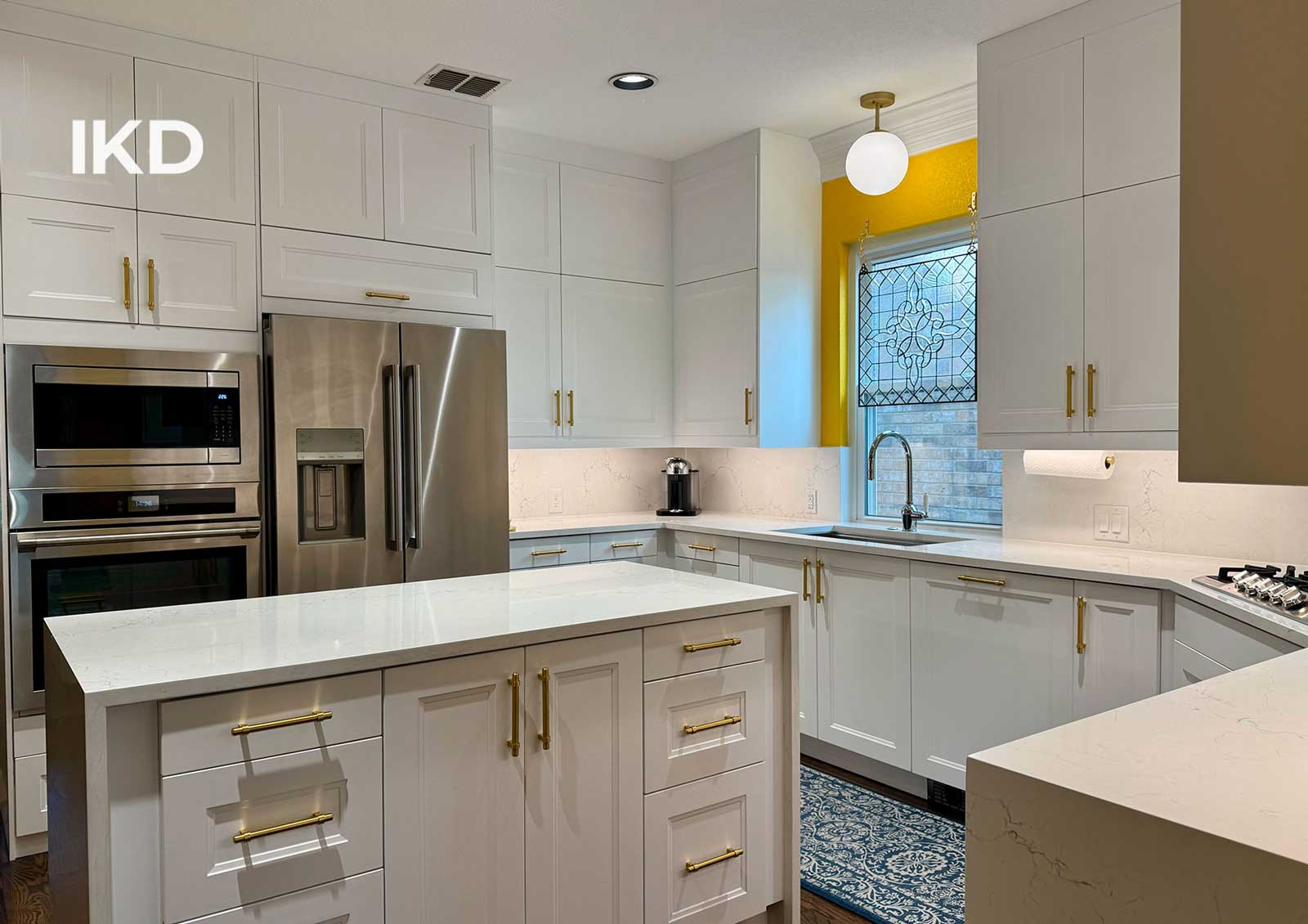 All-white kitchen with IKEA cabinets and AXSTAD doors